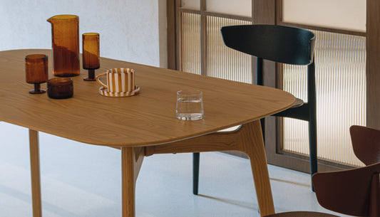 Why do interior designers always recommend oak dining tables for modern homes?